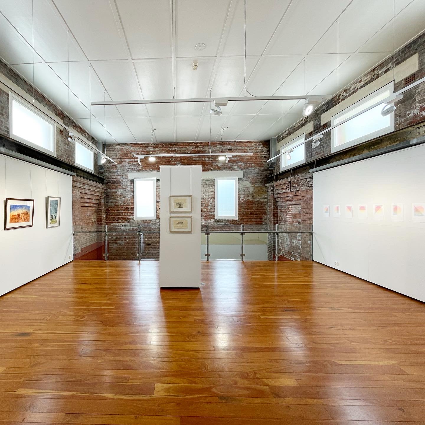 a view of the vast and vivid gallery space - the work of Domenica Hoare, Tess Mehonoshen and Lucy Rebekah is visible